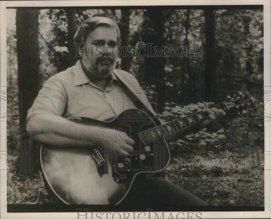 1985, Dr. Gary D. Mills Playing Guitar - abna37380 - Historic Images