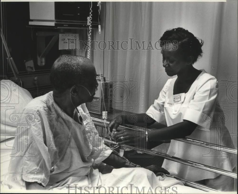 1980, Patient Nathan Moore Tended to by RN Shevorn Porter - abna37702 - Historic Images