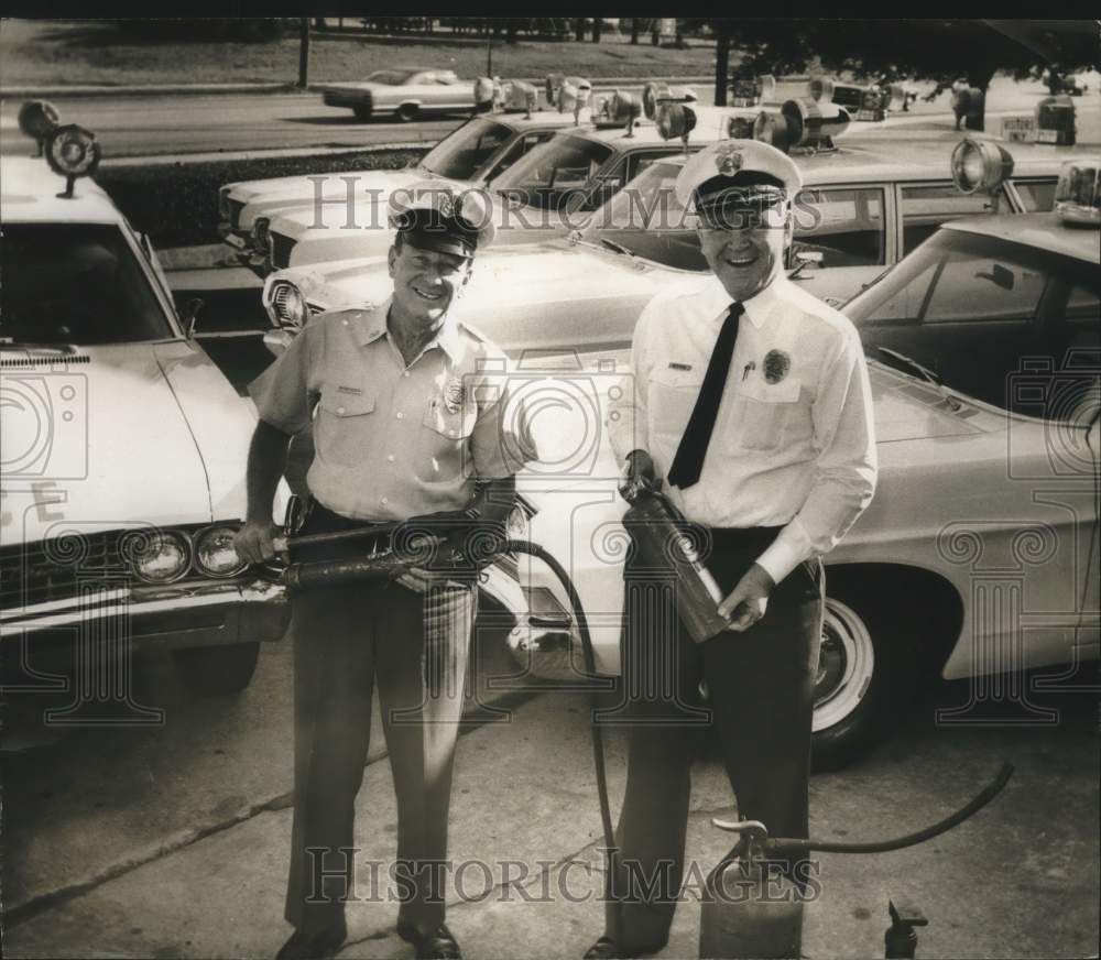 1968, Birmingham, AL police chief Jamie Moore and officer, police lot - Historic Images