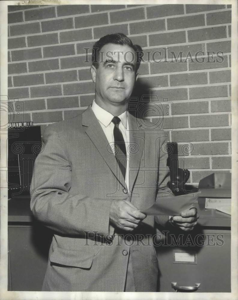 1958, Tom Shinn of Homewood Bank holding papers, Homewood, Alabama - Historic Images