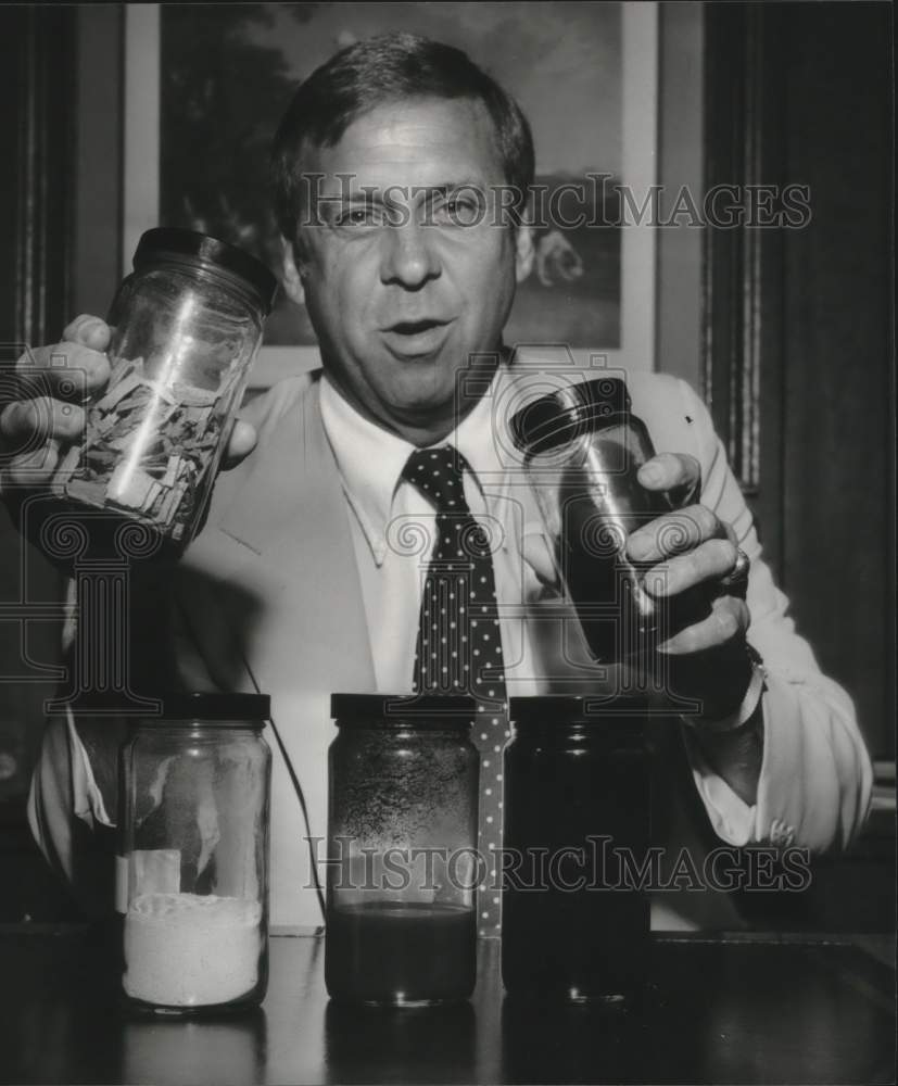 1979, Robert Page of Rust Engineering holding samples - abna38165 - Historic Images