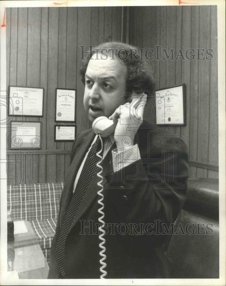 1979, John Pappanastos, Asst. State Finance Dir. talking on telephone - Historic Images