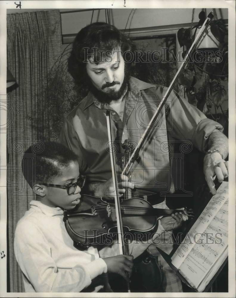 1977, Michael Neumann, Conductor, Teaches Philip Turner on Violin - Historic Images
