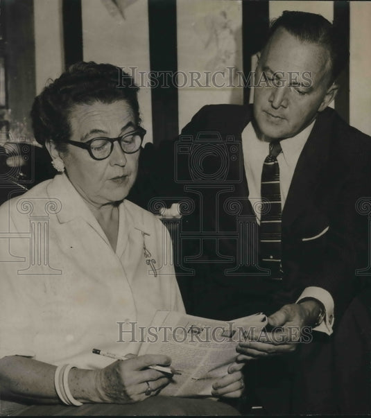 1958, Mrs. Gilbert Vaughn, and William Spoor of Loveman's at Luncheon - Historic Images