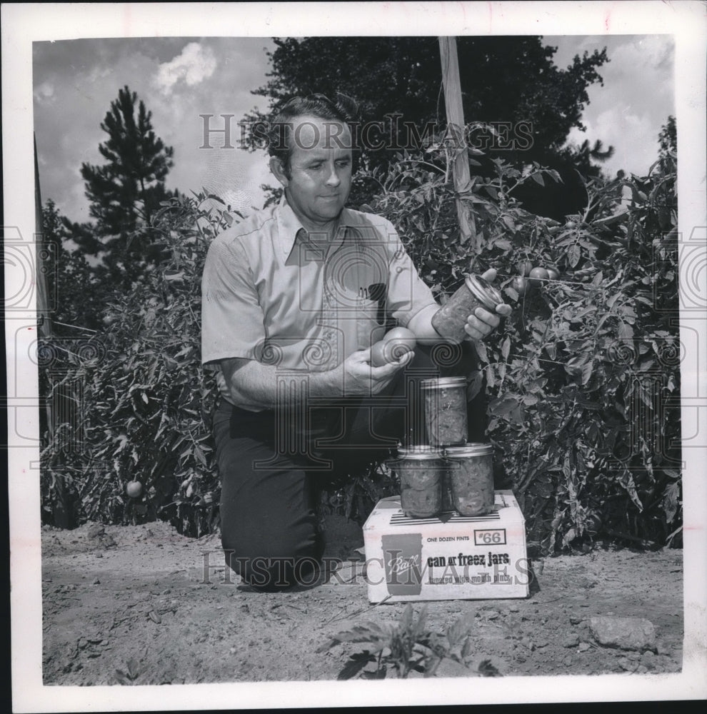 1972, Ken Rymal at Auburn Agricultural Experimental Station with food - Historic Images