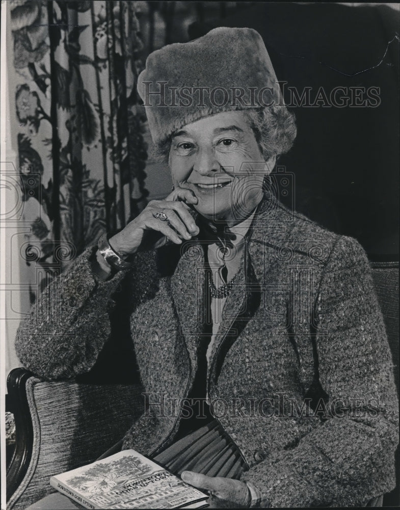 1984 Emily Hearin, holds her book "Downtown Goes Uptown", Alabama - Historic Images