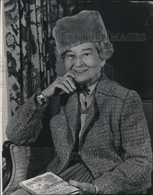 1984 Emily Hearin, holds her book "Downtown Goes Uptown", Alabama - Historic Images