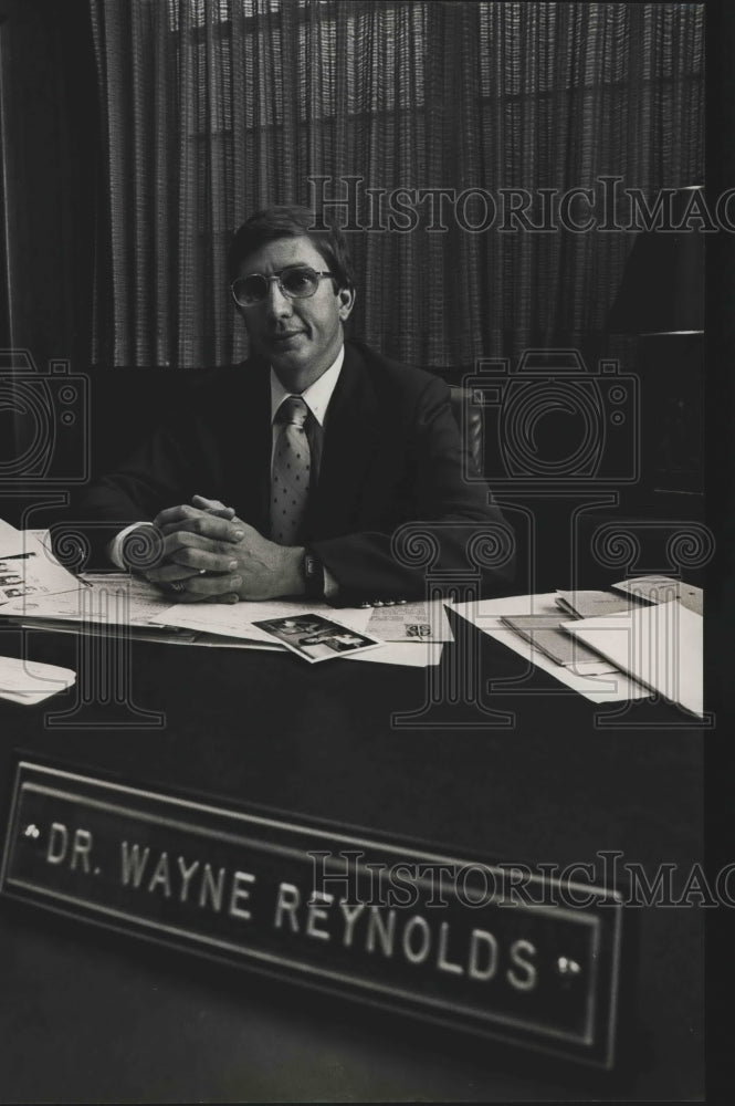 1984 Tarrant Superintendent of Education Dr. Wayne Reynolds at desk - Historic Images