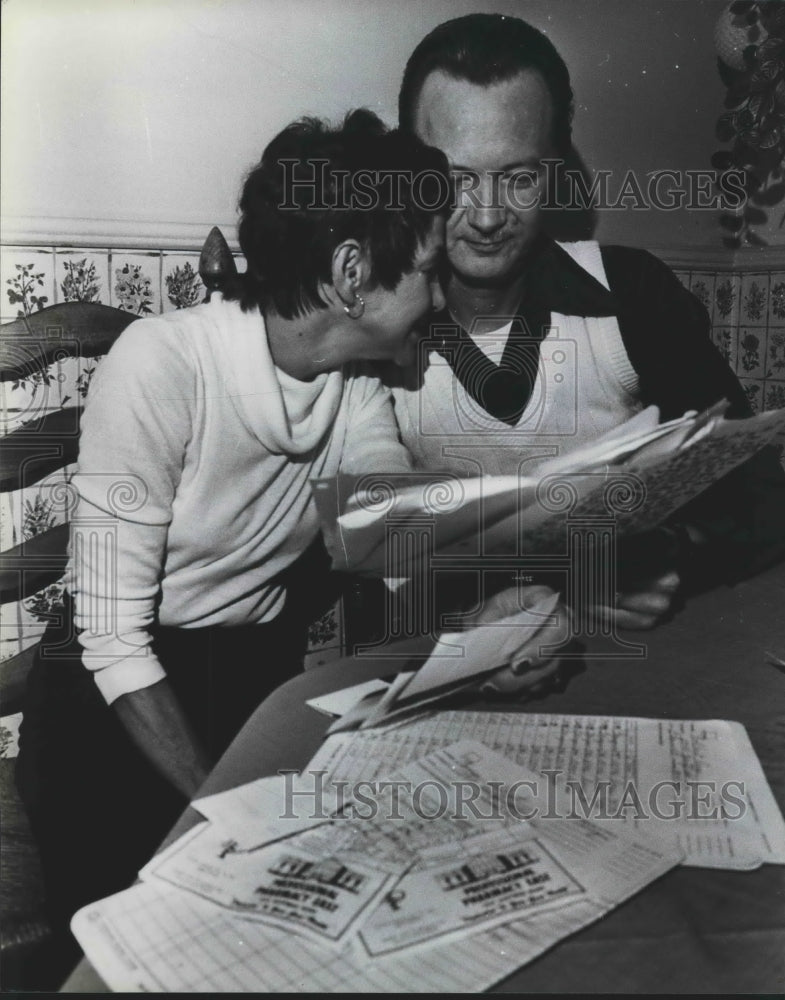 1976, Mr. and Mrs. Ross Tolbert with pile of Medical Bills - Historic Images