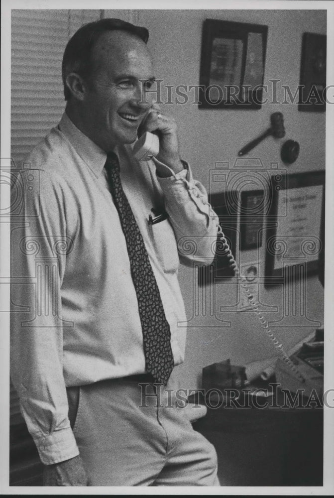 1988, Tommy Snowden being congratulated by a friend over the phone - Historic Images