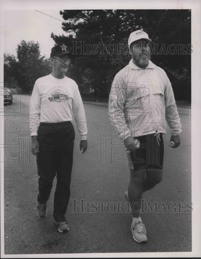 1988 Ernie Sosebee, left, and Tom Duley walk their last charity mile - Historic Images