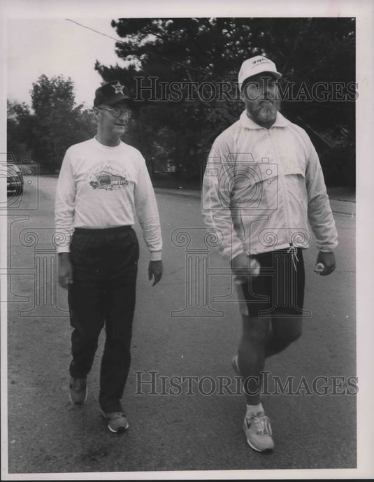 1988 Ernie Sosebee, left, and Tom Duley walk their last charity mile - Historic Images