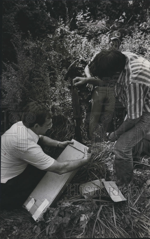 1982, Police Officers Marvin Roye and Gary Wallace check shotgun - Historic Images