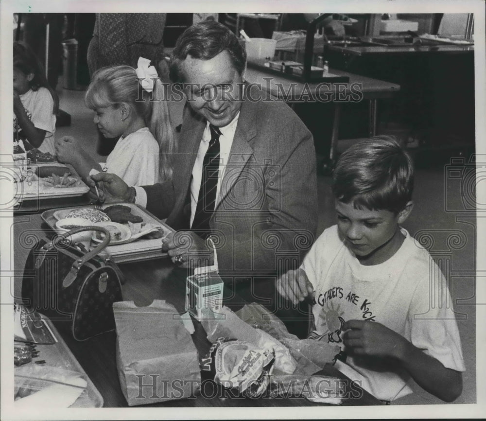 1989, Jefferson County Superintendent Herb Sang ate with Student - Historic Images