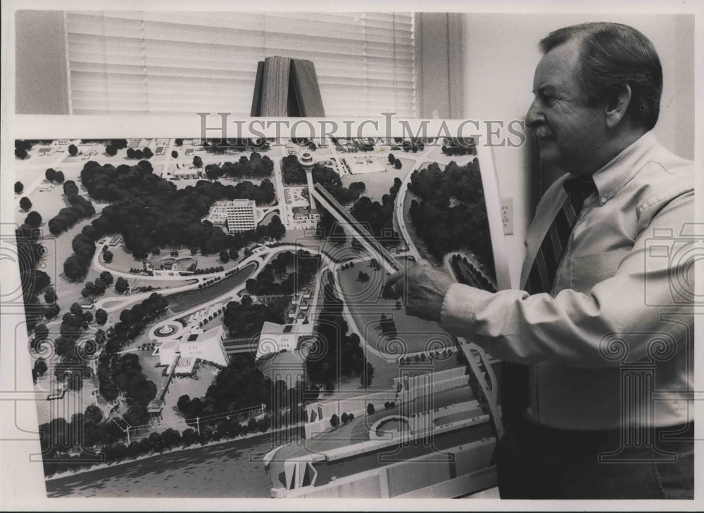 1988, Robert R. Martin with plan of Renaissance Tower at Wilson Dam - Historic Images