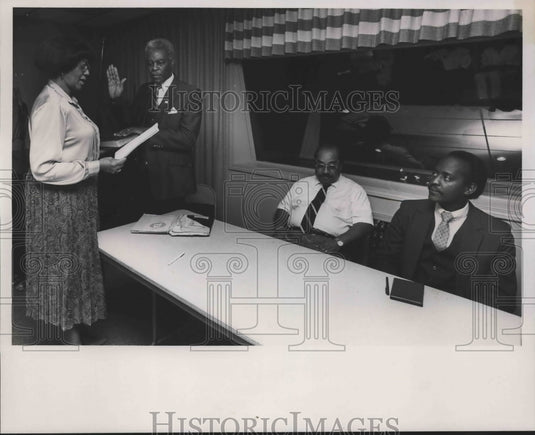 1988, Man is Sworn by Woman - Two Men Seated at Table - abna39924 - Historic Images