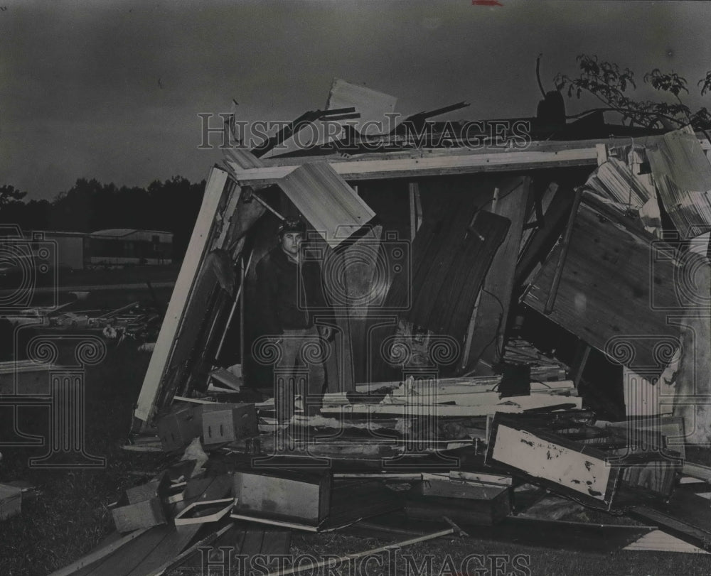 1984, Dale Henderson outside tornado damaged trailer in Alabama - Historic Images