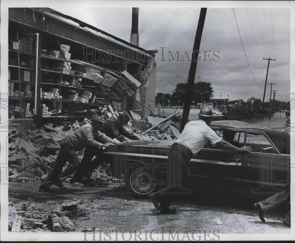 1967 Press Photo Men Attempt to Remove Car From Tornado Wreckage, Alabama - Historic Images