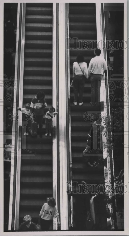 1987, Shoppers ride the escalators at the Riverchase Galleria - Historic Images