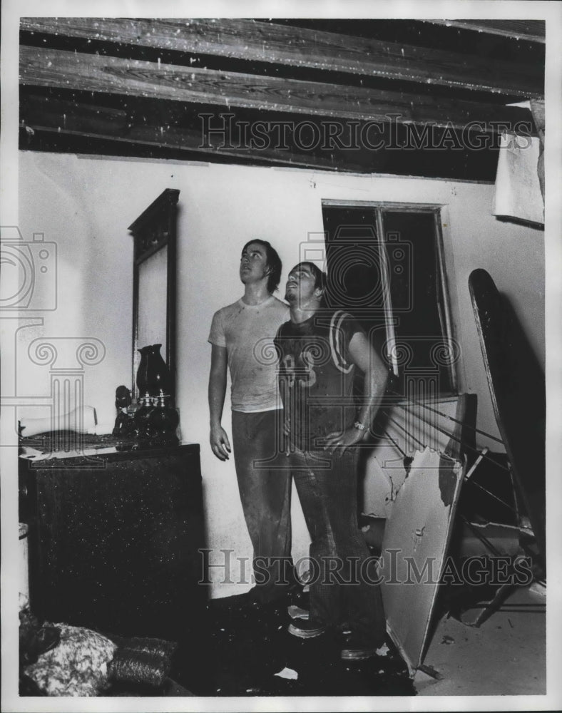 1975 Press Photo Two men examine damage in home after Tornado - abna40256 - Historic Images