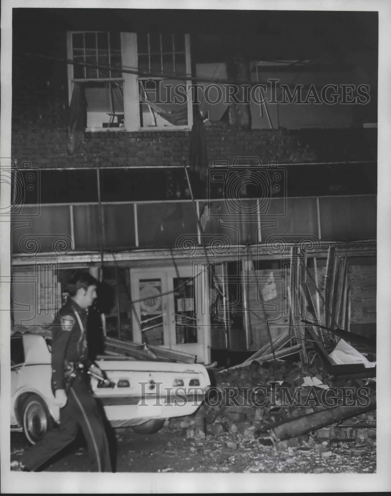 1975 Police Officer surveys damage after Tornado in Alabama-Historic Images
