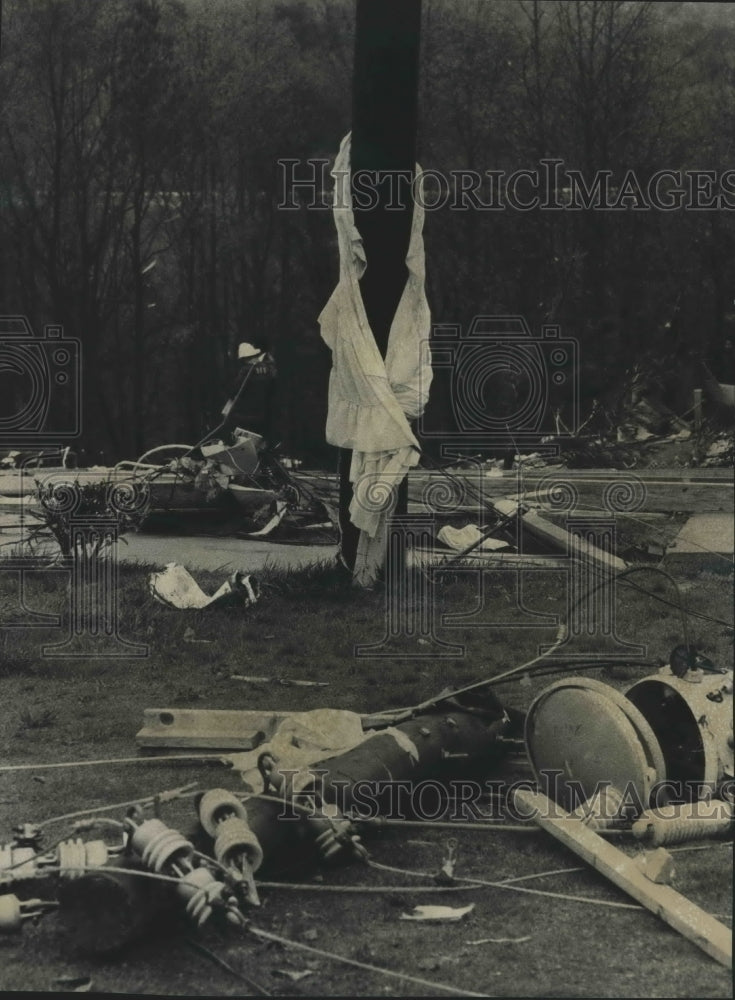 1977 Torn curtains circle a telephone pole after Alabama Tornado - Historic Images