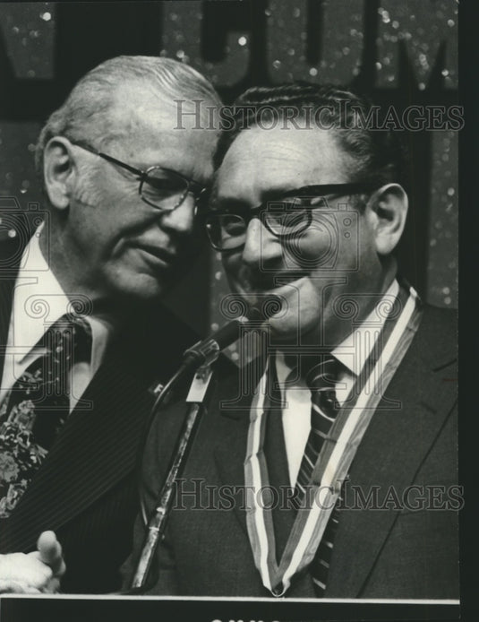 1975, Henry Kissinger with J. D. Hayes at microphone in Birmingham - Historic Images