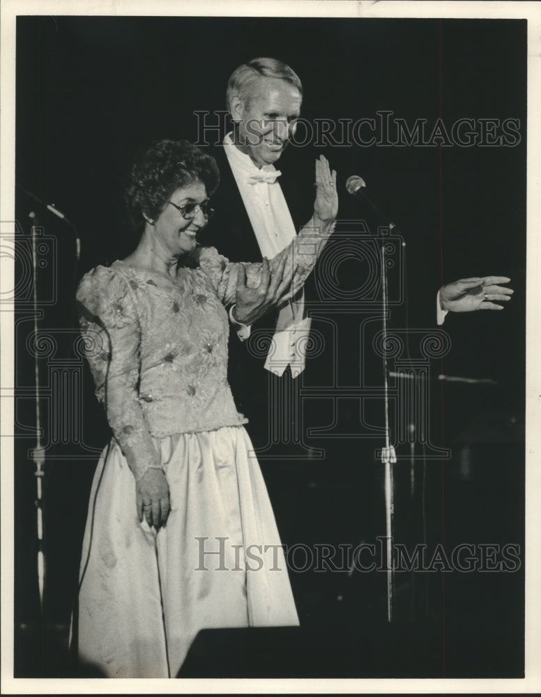 1987 Guy Hunt and wife wave at Young Alabamians Ball - Historic Images