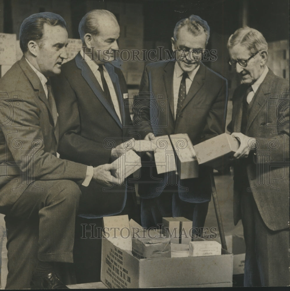 1962, Officials Inspect Food Donations for Alabama Families - Historic Images