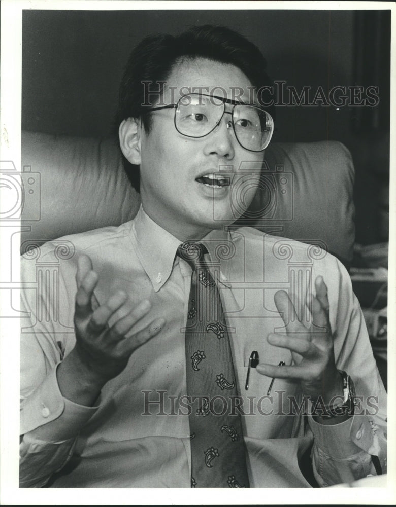 1989, Restaurant owner Herbert Hsu speaks - abna40937 - Historic Images