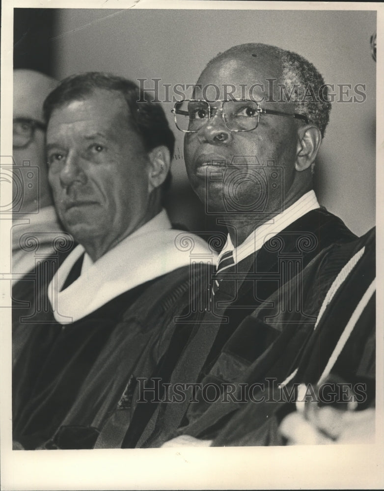 1985 Osadolor Imasogie and unidentified person at Samford graduation - Historic Images