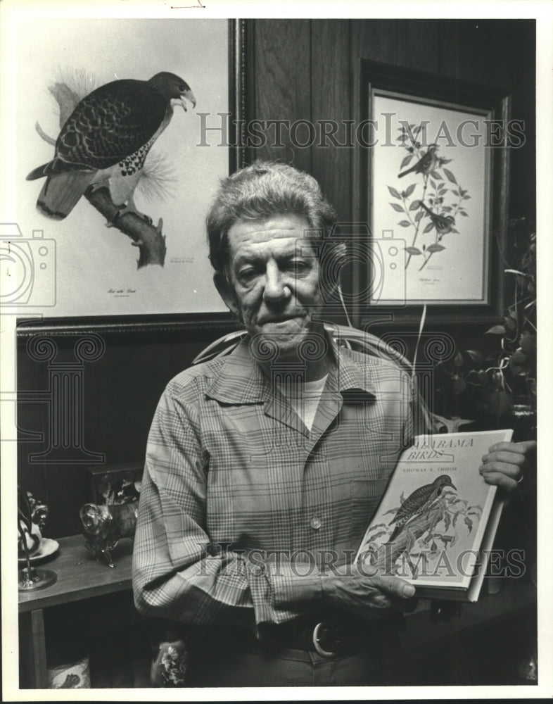 1980, Thomas Imhof, author, with book he wrote on Alabama birds - Historic Images