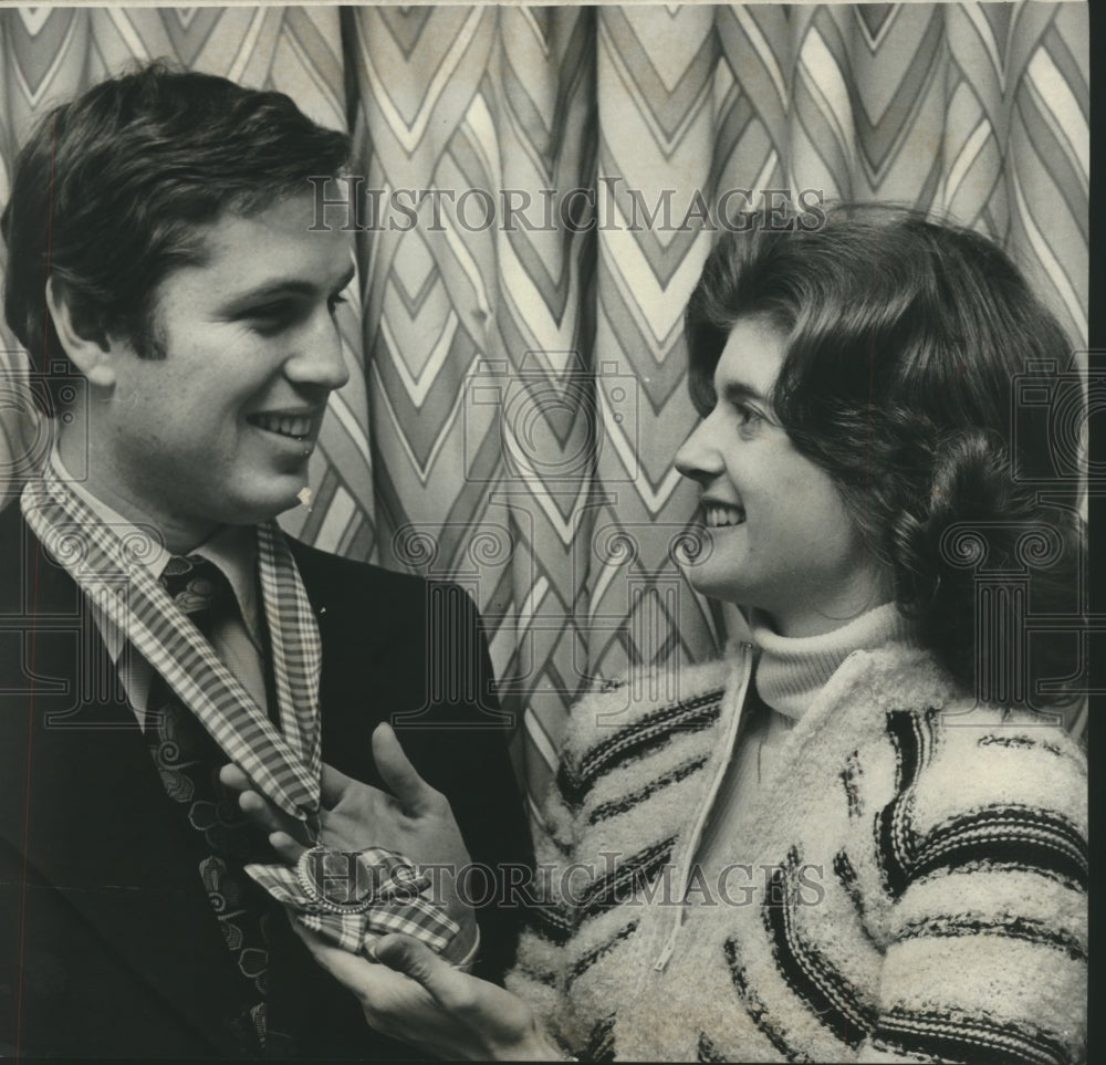 1977 Donald Hess receives special medallion from Mrs. Charles Porter - Historic Images