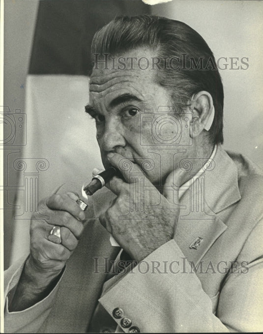 1979, Former Governor of Alabama, George C. Wallace lights cigar - Historic Images