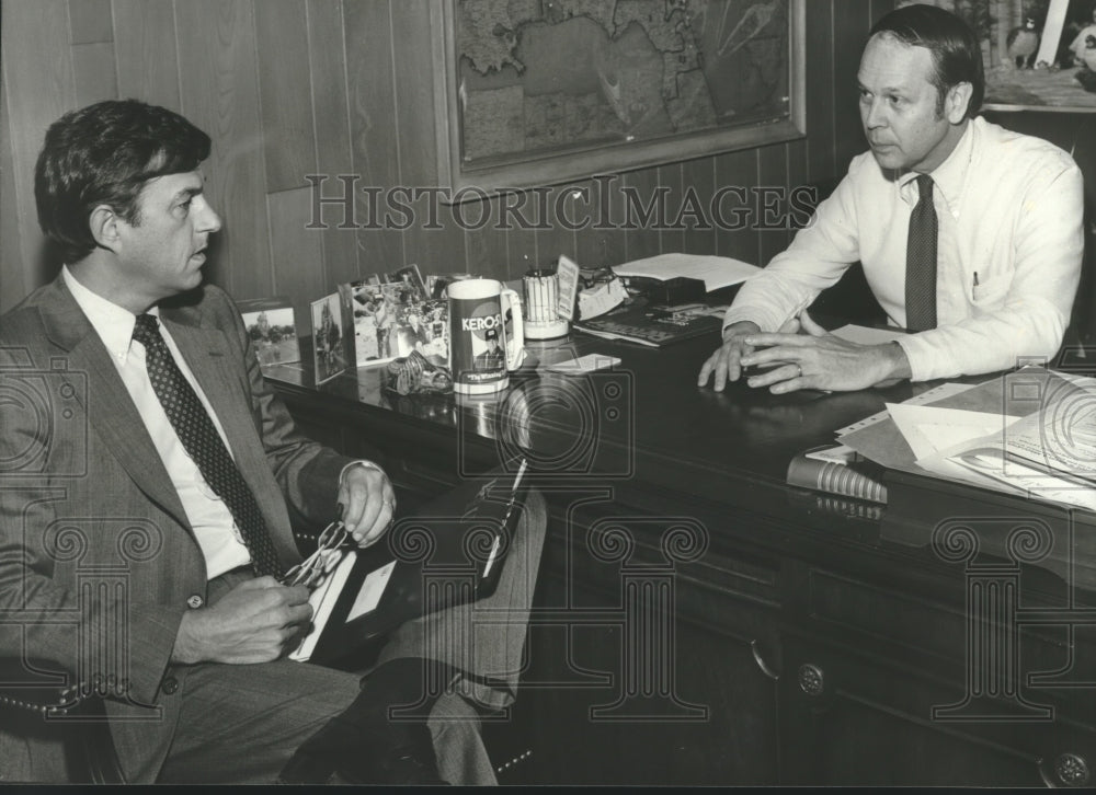 1981 U.S. Diplomat George Griffin talks trade with Jerry Miller - Historic Images