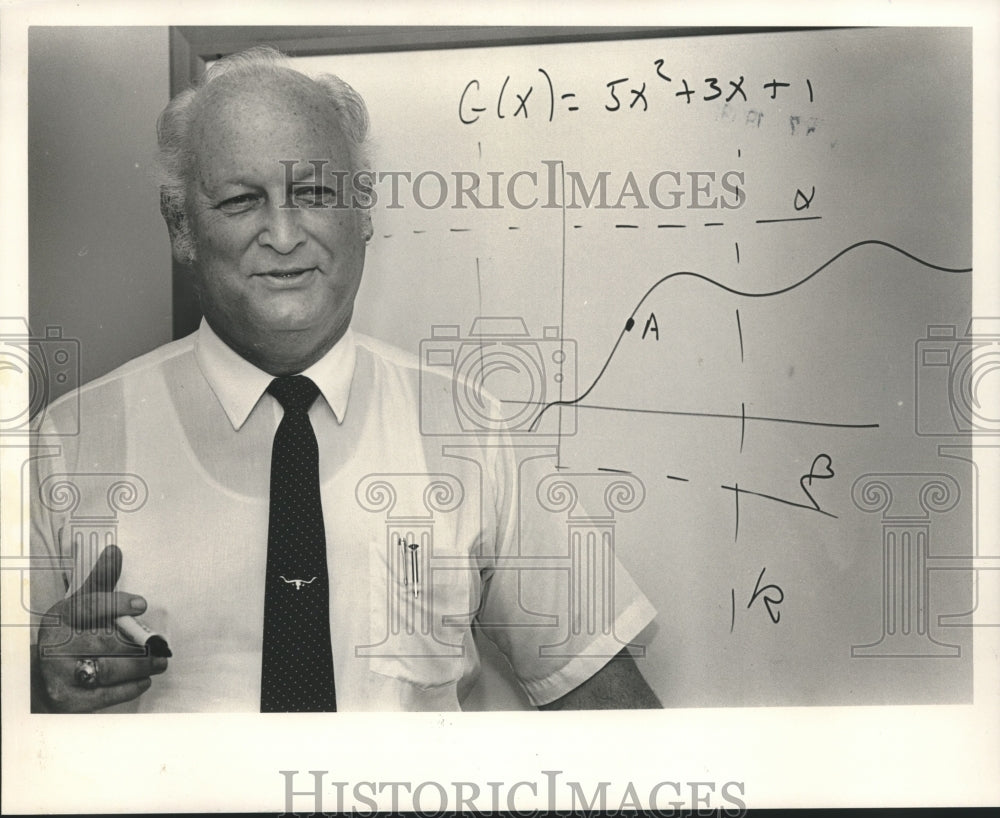 1988, Math professor Reginald Traylor with math equation on board - Historic Images