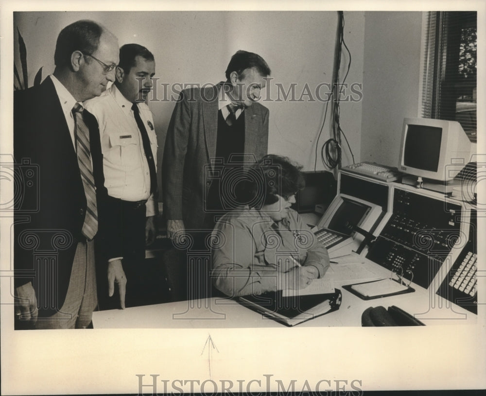 Press Photo Police Chief, Fire Marshall, Fire Chief, and Dispatcher in Room - Historic Images