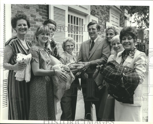 1987 Women's Council of Realtors with gifts for Hannah Home, Alabama - Historic Images