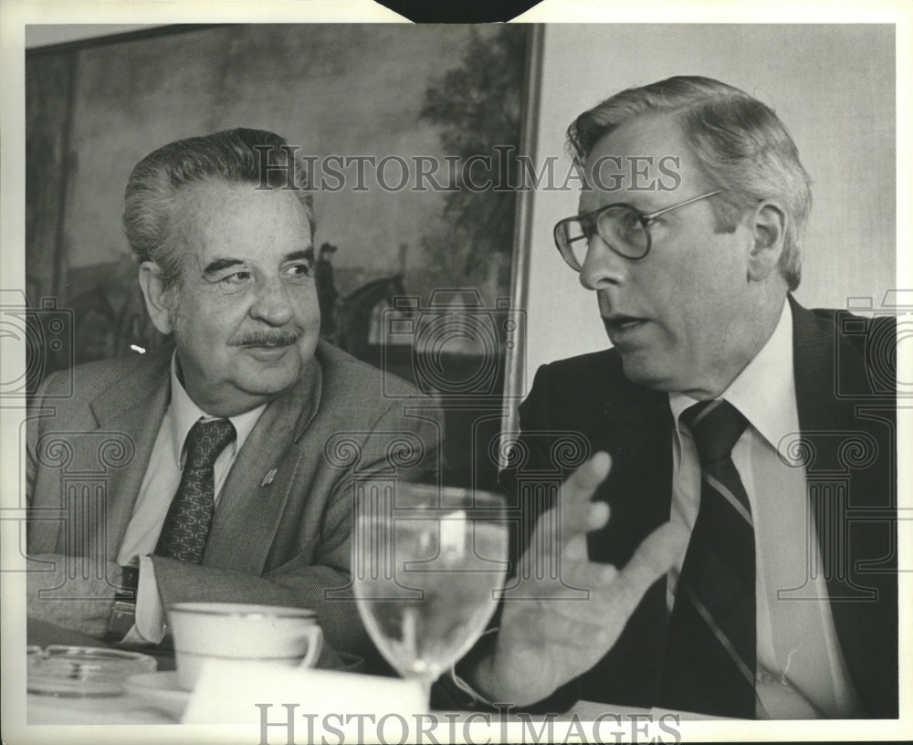 1981 Rex J. Lysinger, Alabama Gas, talking with unidentified person - Historic Images