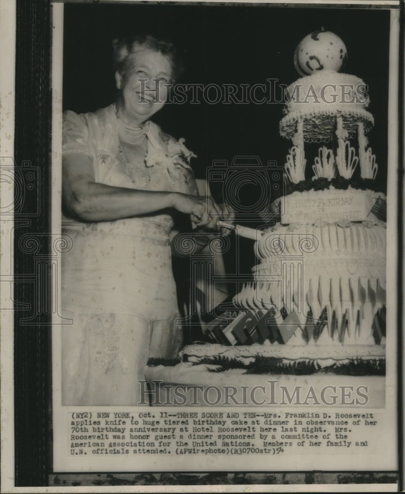 1954, Mrs. Franklin D. Roosevelt cuts her 70th tiered Birthday cake - Historic Images