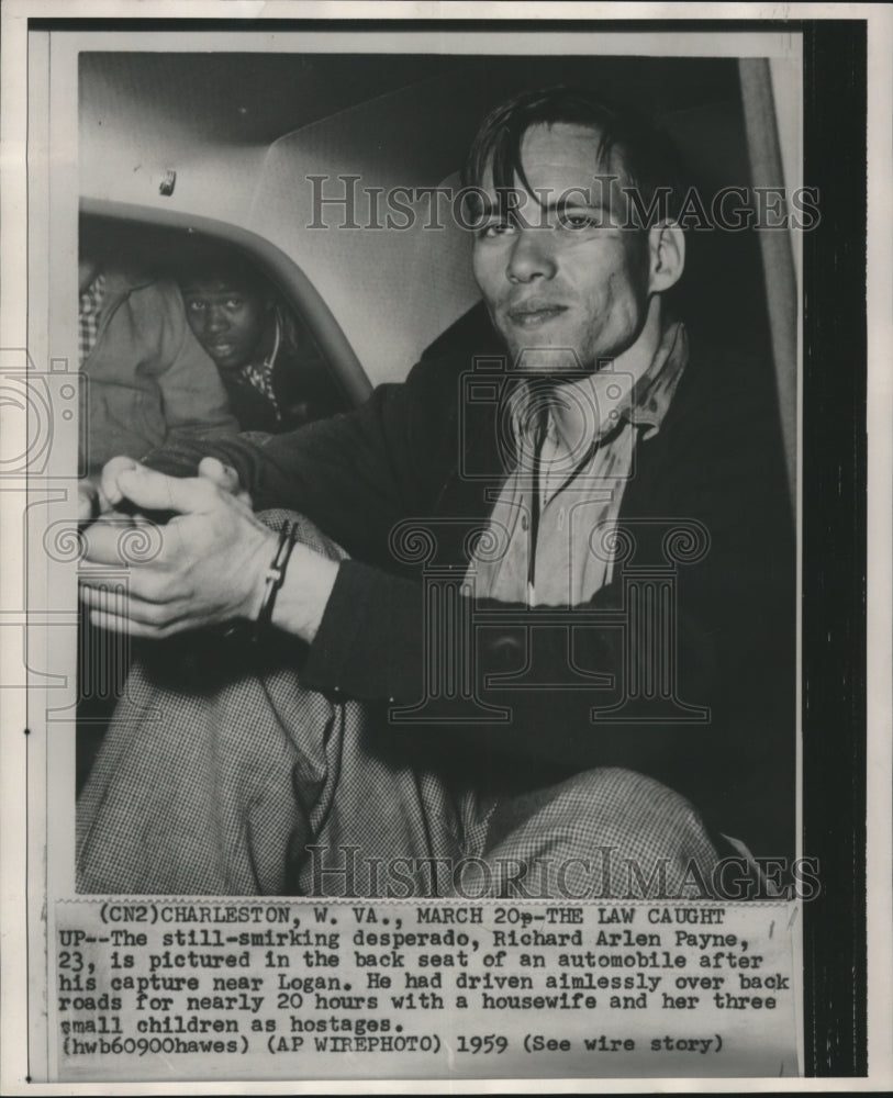 1959 Press Photo Richard Arlen Payne handcuffed after 20 hour hostage situation - Historic Images