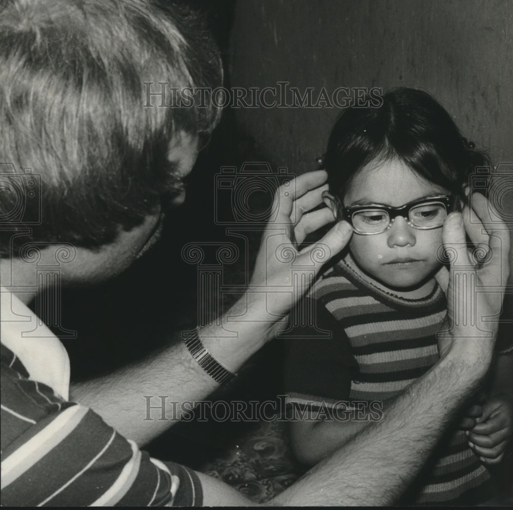 1978 Dr. Robert Kline Fits Young Girl's Glasses in Guatemala - Historic Images