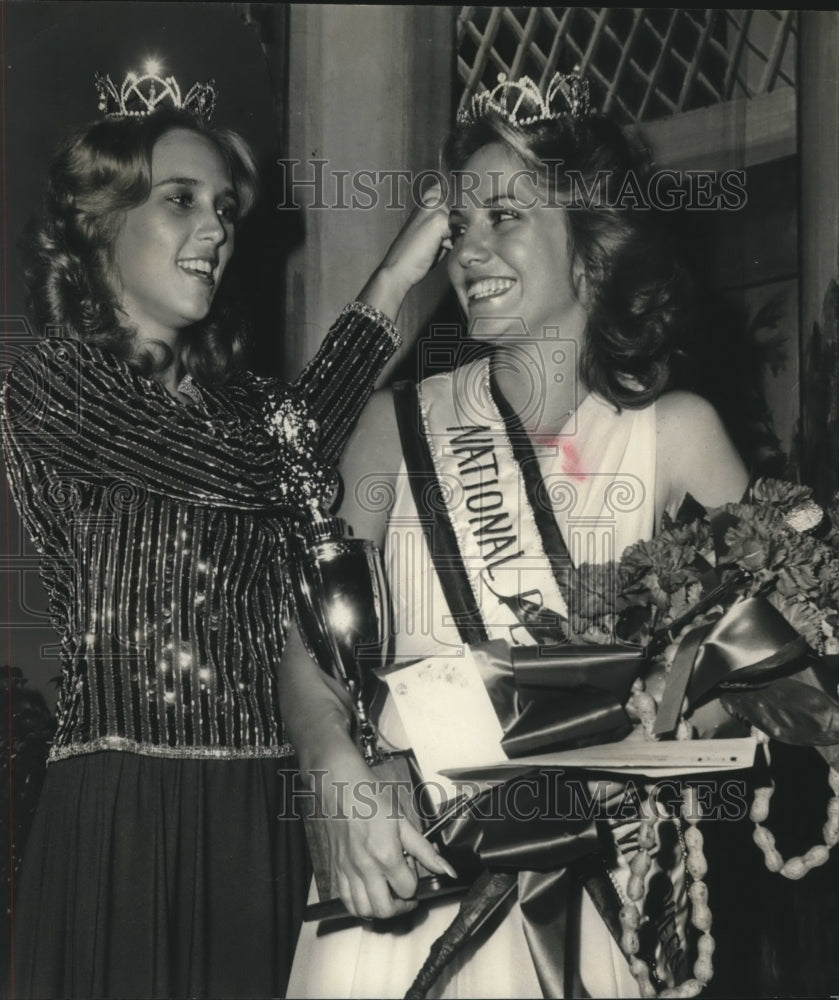 1977, Sharon Riddle places crown on Tammy Lee Wilson, National Peanut - Historic Images