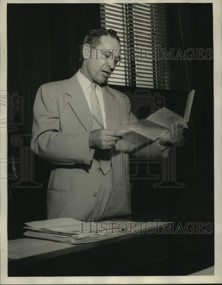 1954, William C. Brannon, Alabama politician, reads documents - Historic Images