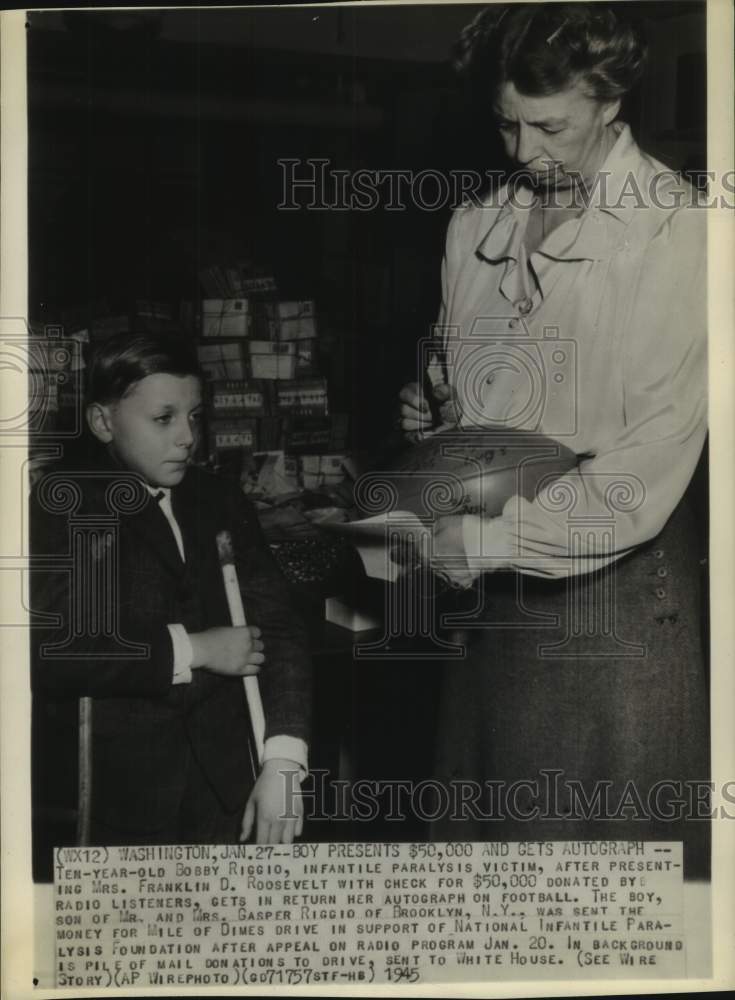 1945, boy gives donation check to Eleanor Roosevelt at White House - Historic Images