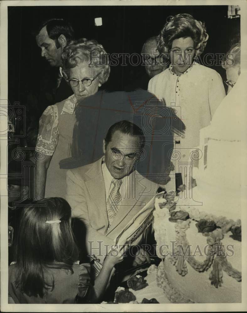 1973, Alabama Governor George Wallace at party, speaking to child - Historic Images