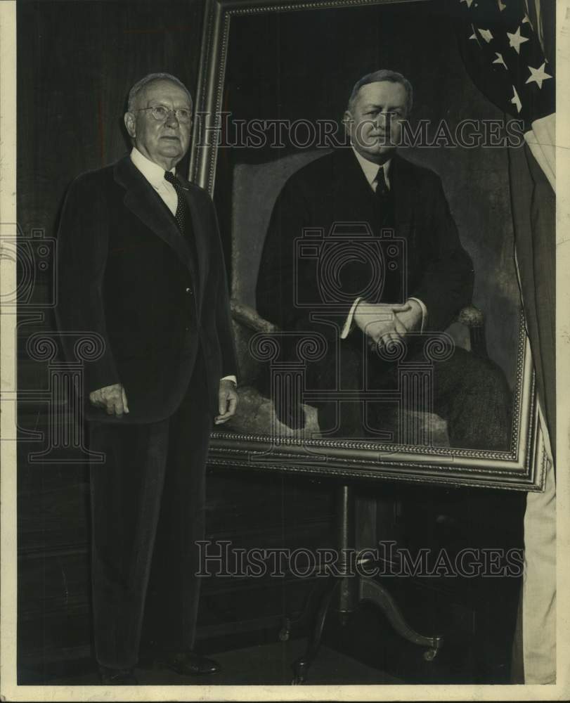 1949, Hugh Morton in front of portrait - abna44572 - Historic Images