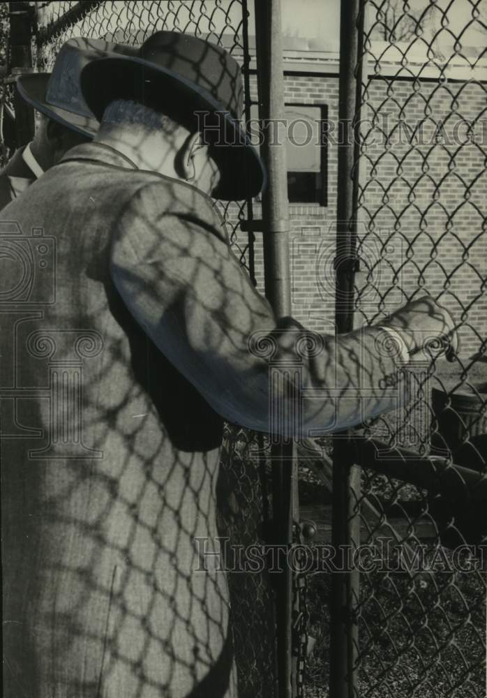 1955, E.H.Thompson, Fred Bodeker locking gate during strikes, Alabama - Historic Images