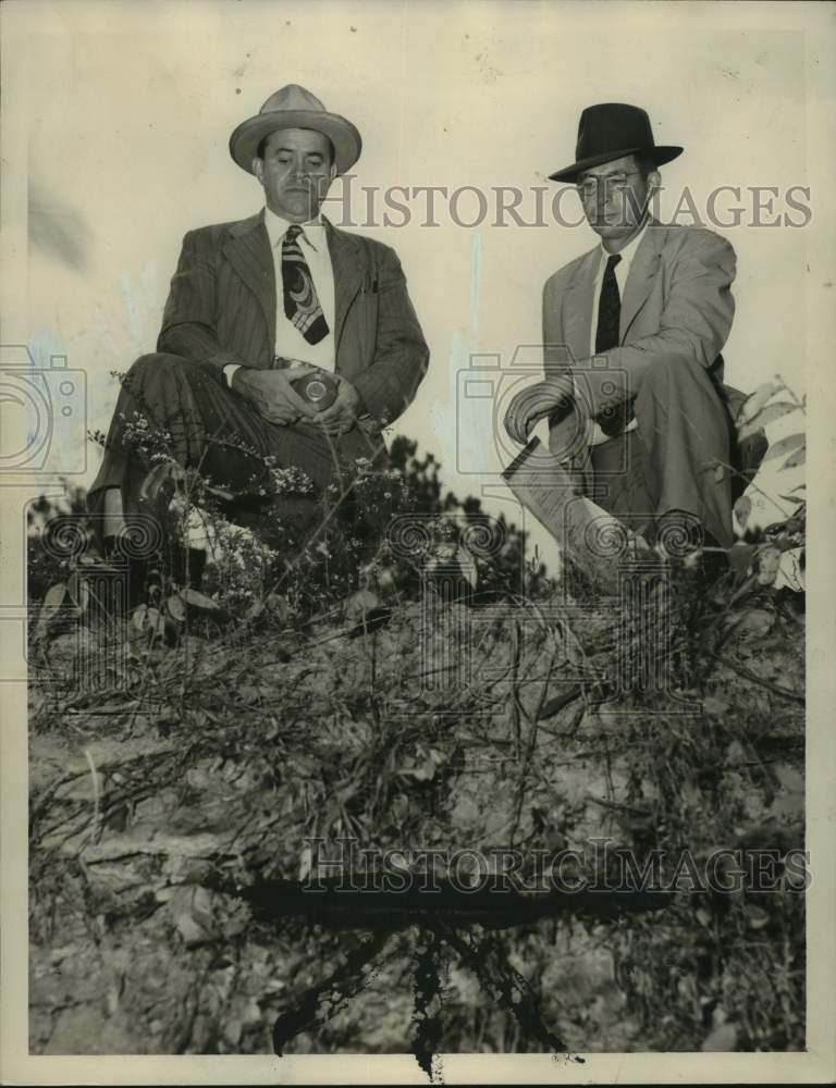 1947, Hogan &amp; Jordo looking at ravine that Corinee Limbaugh was found - Historic Images