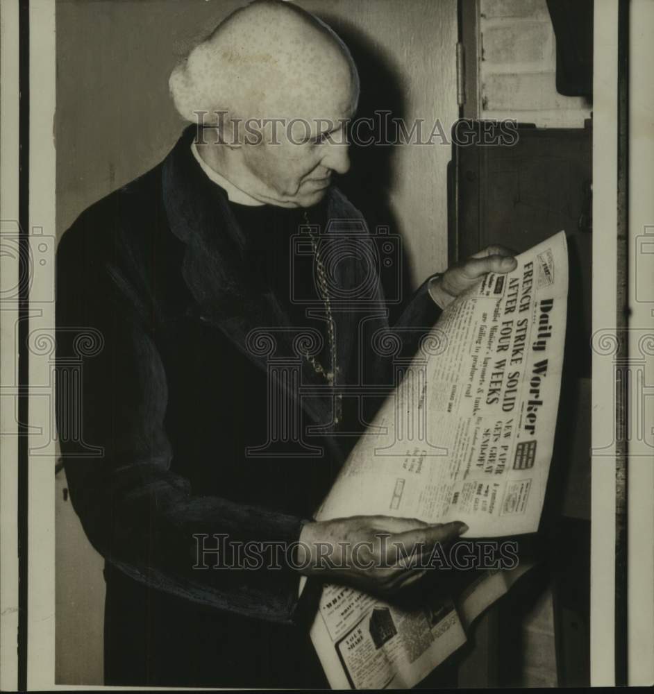 1948, Dr. Hewlett Johnson, Dean of Canterbury, reads Communist paper - Historic Images